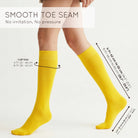 Unisex wearing yellow Mysocks knee-high combed cotton socks
