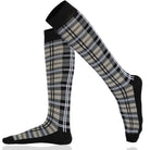 Plaid knee-high socks with black accents on a white background