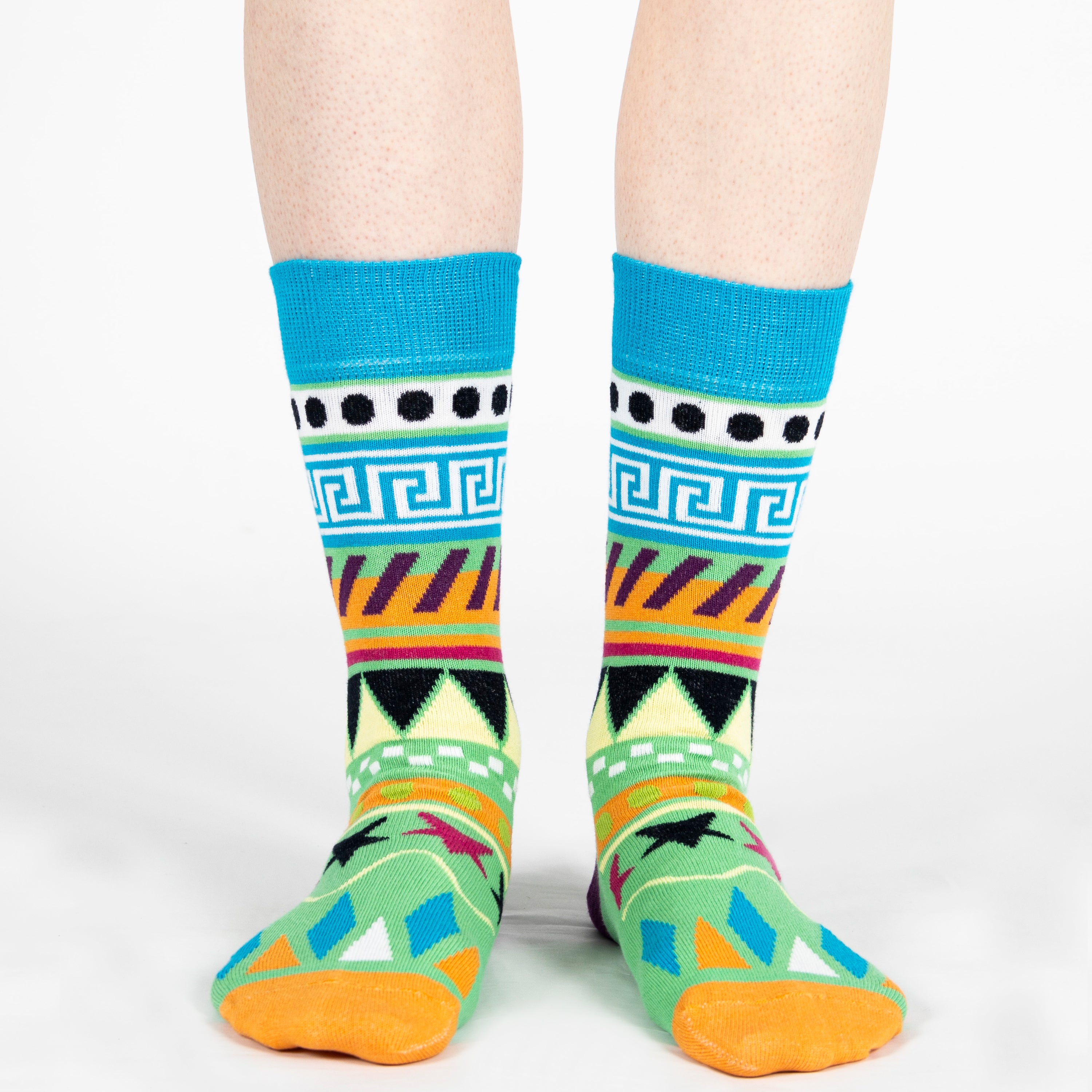Pair of unisex Mysocks Aztec crew socks featuring vibrant geometric patterns in teal, yellow, and green, displayed on a white background.