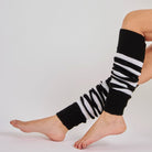 Woman wearing Mysocks black and white striped 100% acrylic leg warmers