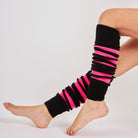 Woman wearing Mysocks fuchsia and black striped acrylic leg warmers