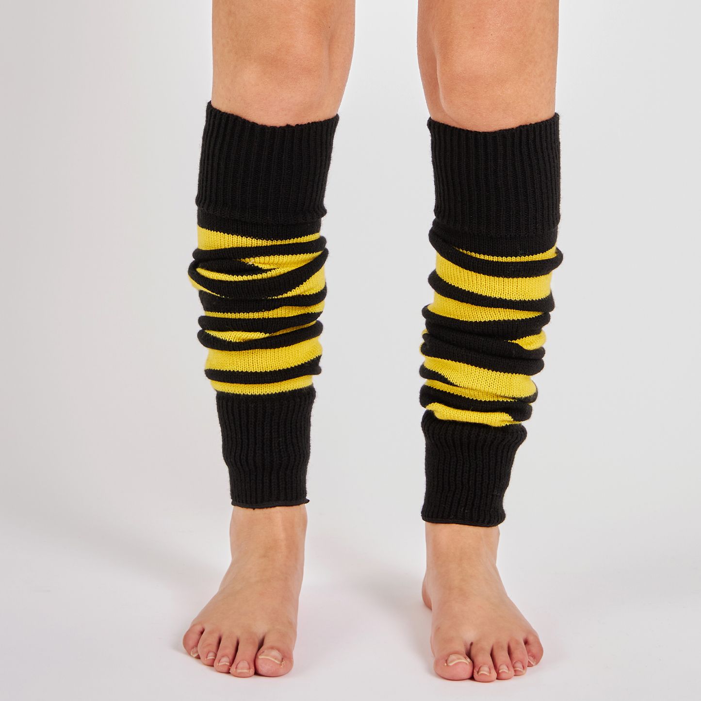 Woman wearing Mysocks yellow and black striped knit leg warmers