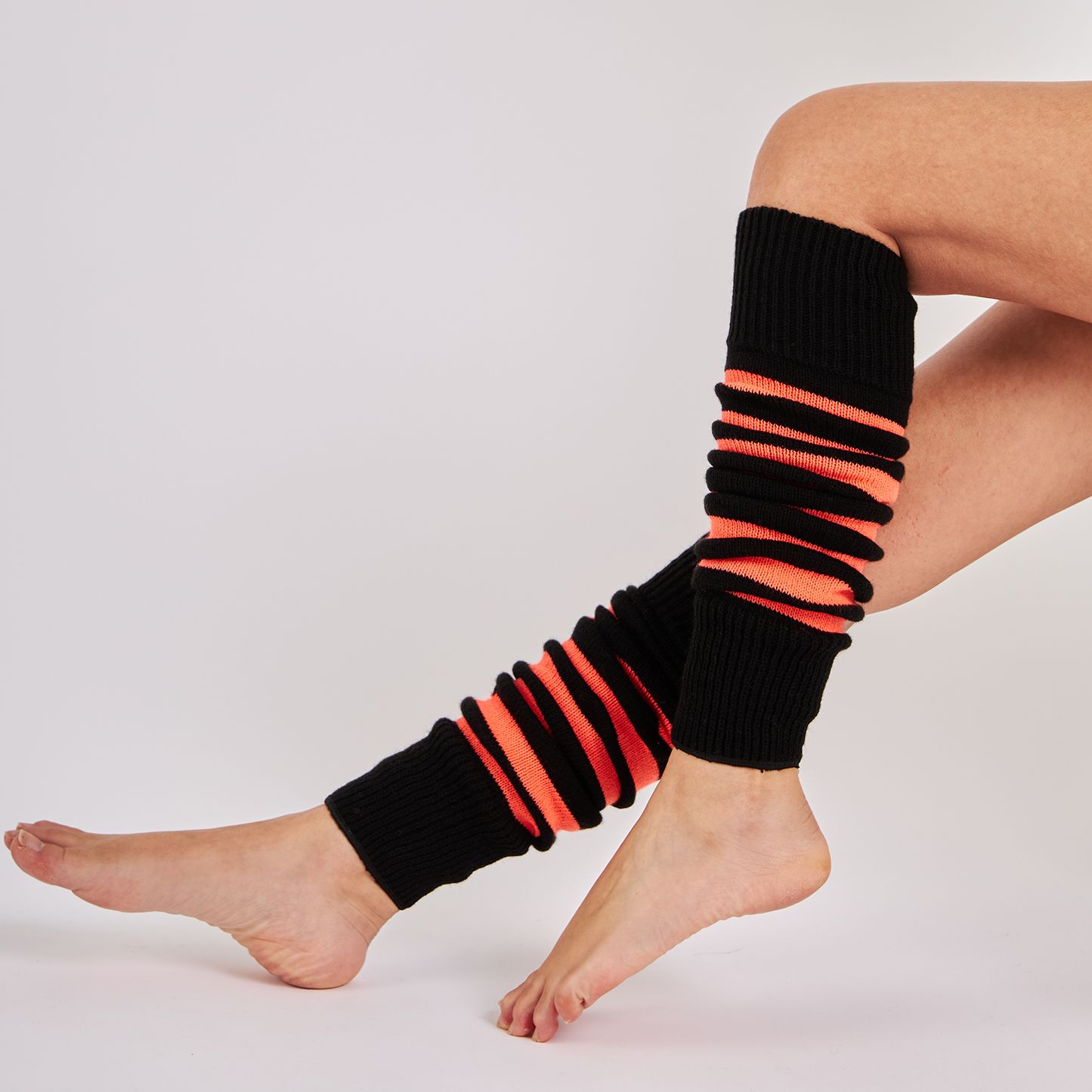 Mysocks women's soft acrylic orange and black striped leg warmers worn on legs
