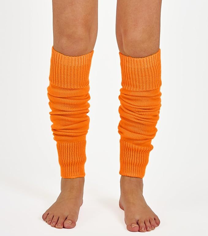 Woman wearing bright plain orange ribbed knit leg warmers.